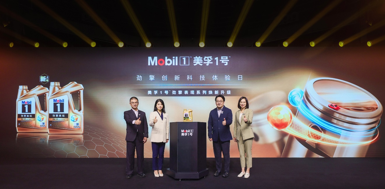 A group of people standing on a stage

Description automatically generated